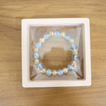 Live wrist view of elegant dual-tone crystal beaded stretch bracelet