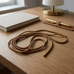 Close-up of brown spiral cable protector sleeve for cable durability