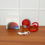 Interactive cat toy ball showing USB charging port and included cable