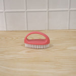 Person using multi-purpose cleaning brush on surface for deep cleaning