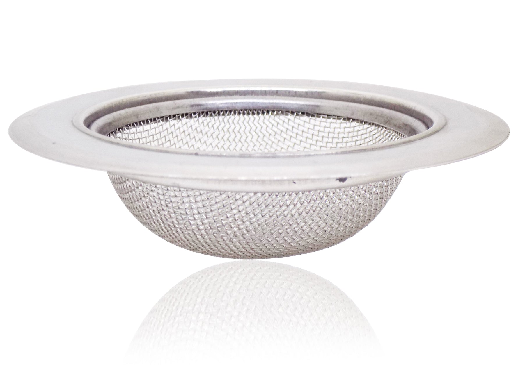 Stainless steel sink strainer seamlessly installed in a modern kitchen basin.