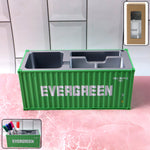 Container-style desk organizer holding pens and stationery on office desk.