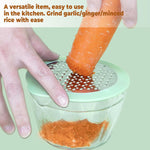 Compact manual vegetable grater showing corn kernels collected in storage bowl