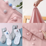 Close-up view of Soft Duvet Button Clip showing locking mechanism