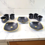 Elegant seashell ceramic cup set with matching plastic bowls arranged for serving.