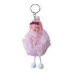Hand holding plush doll keychain featuring soft fur ball accessory