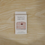 Model’s hand adorned with glamorous glitter 3D floral press-on nail tips for special events.