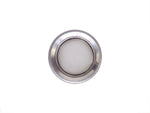 Stainless steel drain strainer placed inside a kitchen sink, ready for use.
