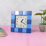 Angled view of the compact square table clock, ideal for small spaces.