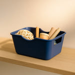 Compact utility basket organizer shown with handles for easy carrying