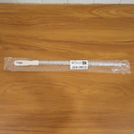 Flexible drain cleaning brush used in kitchen sink for easy clog removal