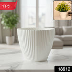 Close-up of white ribbed texture on modern flower pot