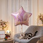 Star marble foil balloon inflates for celebration