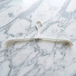 Foldable plastic hanger, ideal for space-efficient wardrobe storage