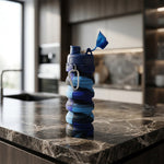 Side view of expanded colorful collapsible silicone water bottle