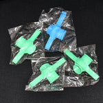 Multiple Food Pouch Sealer Clips in various colours on a kitchen counter.