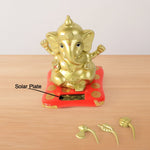 Decorative religious idol of Lord Ganesha with vibrant red base