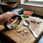 Spoon designed for easy scooping and spreading of crushed garlic