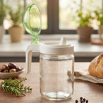 Kitchen oil dispenser bottle with green lid for controlled pouring