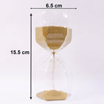 Sand flowing smoothly in glass hourglass timer