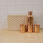 Group shot of the copper water bottle and two glasses, emphasizing the full set.