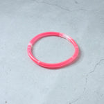 Person enjoying a concert while wearing a bright Glow LED Bracelet.