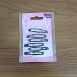 Model wearing snap hair clips styled in wavy hair