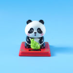 Solar energy powered panda decor with nodding head feature