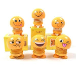 Collection of various smiling face spring toys, showcasing their playful design.