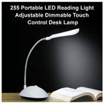 Compact portable LED reading light with sleek touch controls.
