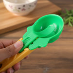 Ice cream scooper with ergonomic handle and a vibrant red scoop.