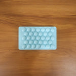 Blue plastic candy shaper for easy DIY lollipops