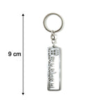 Close-up of Jay Sonal Ma devotional keychain in metallic finish