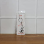Bal Krishna Makhan Chor keychain attached to vehicle keys adding a spiritual charm