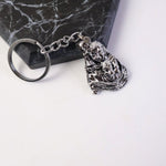 Silver finish metal keychain featuring Bal Krishna idol with sturdy chain and ring
