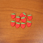 Colorful set of strawberry-themed keychain accessories