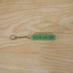 Small gadget key holder with tactile click and LED glow