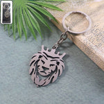 Front view of metal lion head keychain featuring a crowned lion design