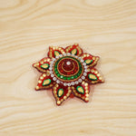 Live setup of the kumkum dani during a pooja ceremony.