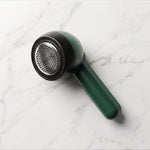 Compact lint remover for fabric grooming and wardrobe care