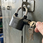 Three unique keys for the anti-theft alarm padlock, ready for secure operation.