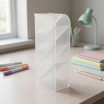 Plastic desk organizer holding office supplies in transparent compartments