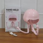 Mini handheld fan with flexible tripod and star projection light in action
