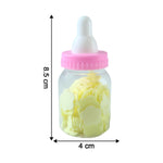 Soap paper sheets in baby bottle container beside a cup of water for use