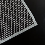 Hand holding the lightweight Large Ironing Press Net mesh protector cloth