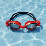 Detailed look at red swimming goggles emphasizing anti-fog lenses