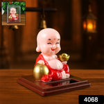 Close-up of the Solar Buddha Car Ornament, highlighting the solar panel for automatic movement.