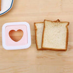 Bread slice with heart shape cut made by sandwich cutter