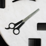 Hair thinning scissors showing detailed micro-toothed blade for bulk reduction