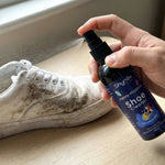 Shoe Cleaner Spray applied on white sneakers to remove stains
